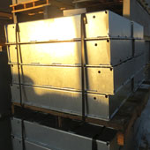 Photo of a stack of HTSG40 Galvanized Steel Covers